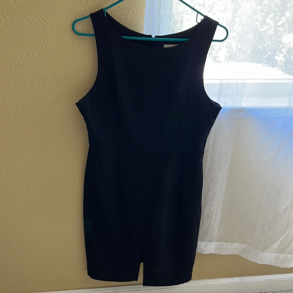 HAVE black tank dress, size medium, back zip , front slit, never worn